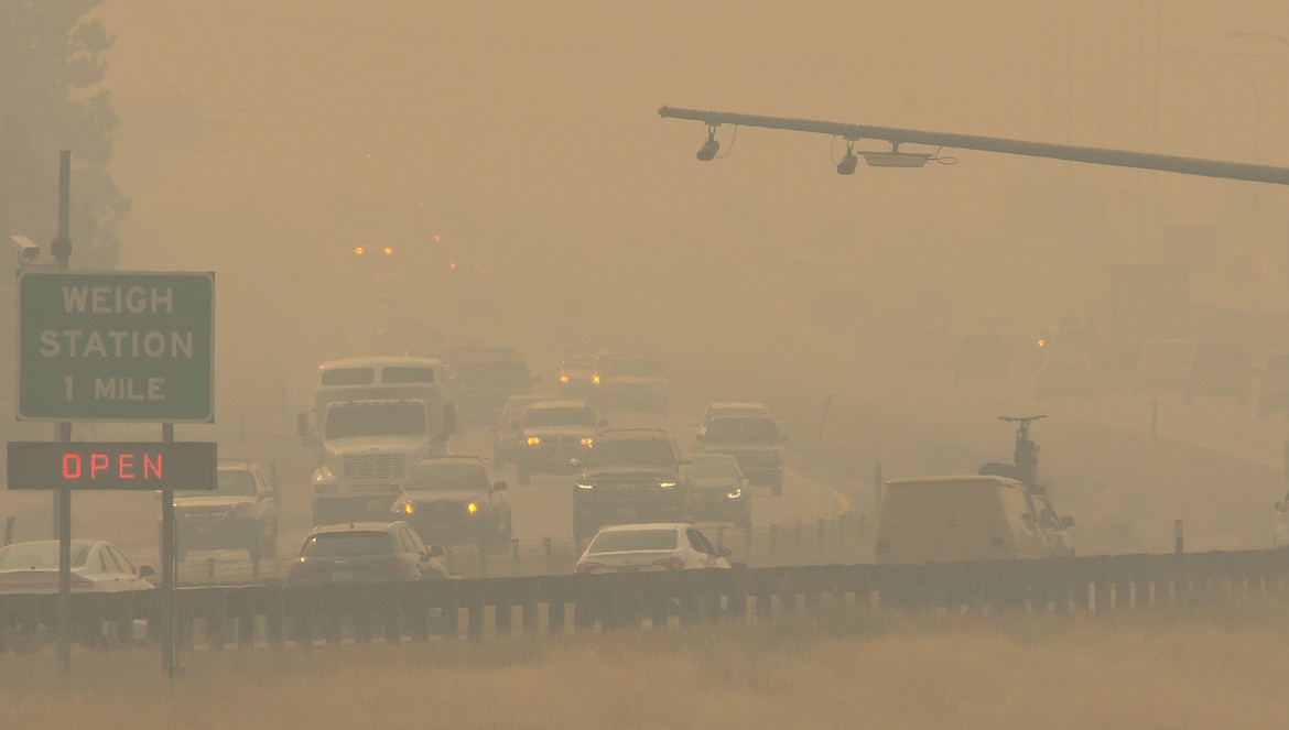 Photo by Christopher Chaffee/LightBenders
Looking westbound on Interstate 90 from Stateline, holiday travelers navigate their way home through thick smoke on Labor Day. Many used headlights for increased visibility by others.