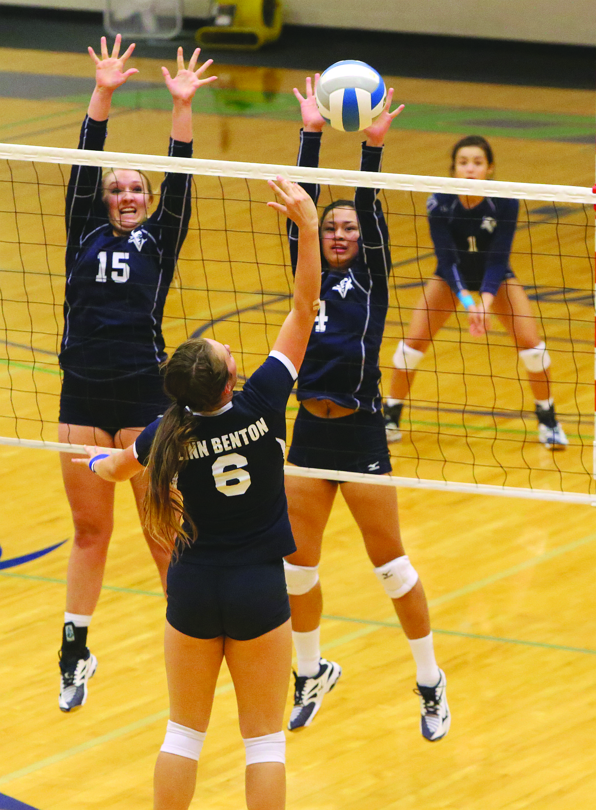 Connor Vanderweyst/Columbia Basin Herald
Big Bend's Maddy Powers (15) and Ryana Recustodio (4) try to block a spike by Linn-Benton setter Madelynn Norris.