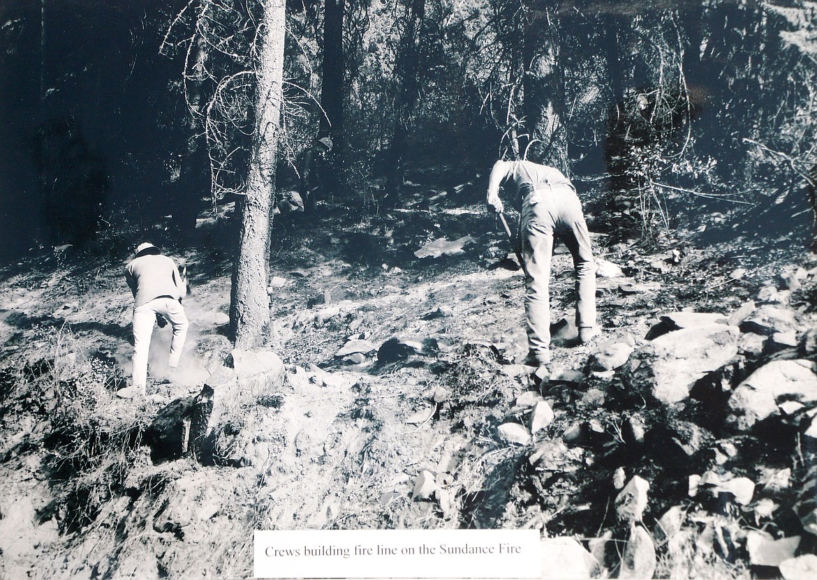 (Photo by CAROLINE LOBSINGER)A photo of a picture at the Sundance Fire 50th anniversary commemoration. The photograph shows crews building a fire line on the Sundance Fire in August or September of 1967.