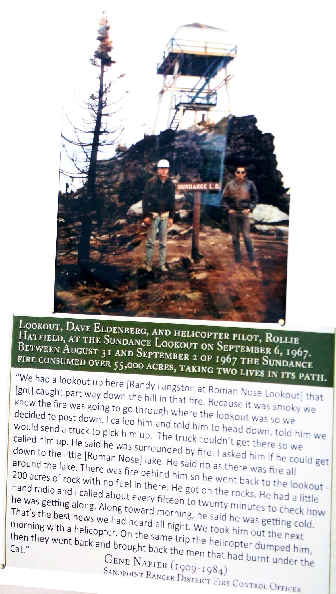 (Photo by CAROLINE LOBSINGER)A photo of a picture at the Sundance Fire 50th anniversary commemoration. The photograph shows Sundance lookout Dave Eldenberg and helicopter pilot Rollie Hatfield at the Sundance Lookout on Sept. 6, 1967, after a massive fire roared through the area.