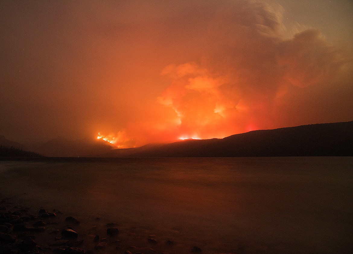 Stoked by fierce winds, the Sprague Fire burns Snyder Ridge and Mount Brown Sunday evening above Lake McDonald.