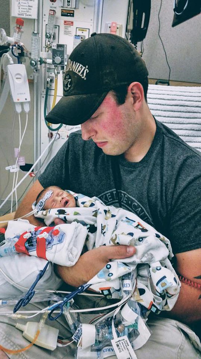 Jackson Stiffler, of Kalispell, holds his newborn son Leroy at Seattle Children&#146;s Hospital in August. Leroy is expected to remain at the hospital for at least three months. (Courtesy of Joleen Beaubien)