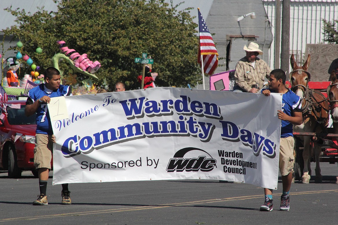 File photo/Columbia Basin Herald
Two Warden High School football players open the parade during a past Warden Community Days celebration.