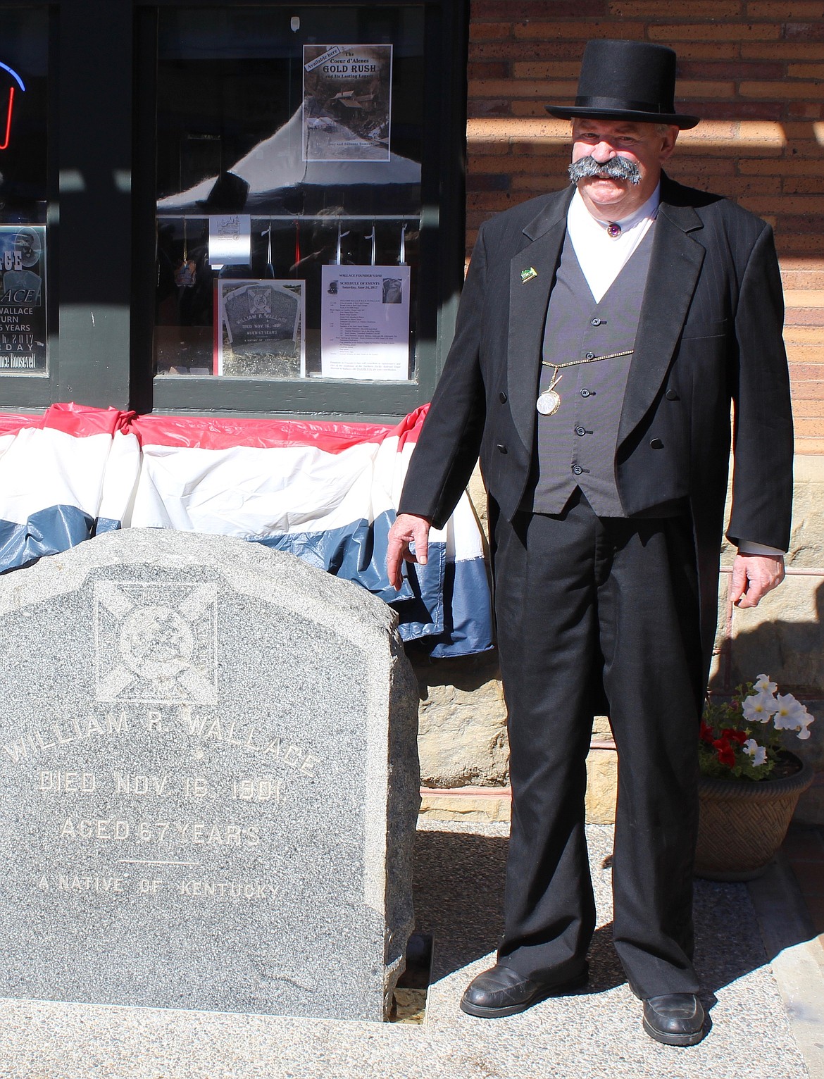 Photo by CHANSE WATSON
Col. Wallace (AKA John Turner) poses with &#145;his&#146; headstone in June next to the Northern Pacific Railroad Museum.