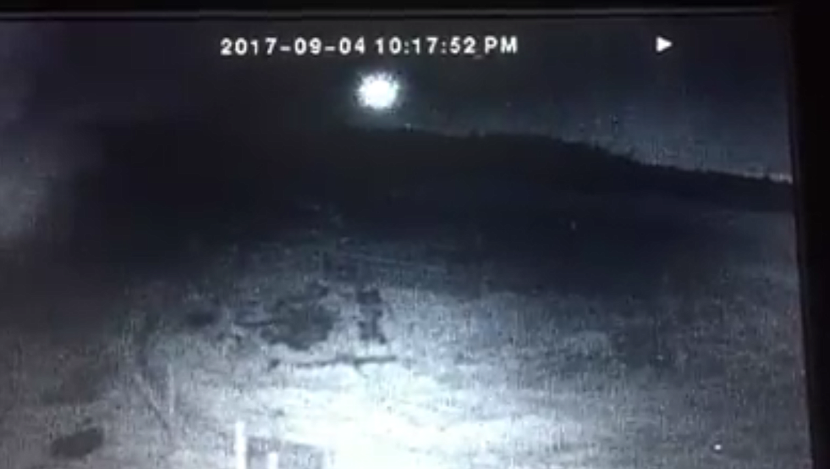 Still images from a surveillance camera video shows the approaching fireball.