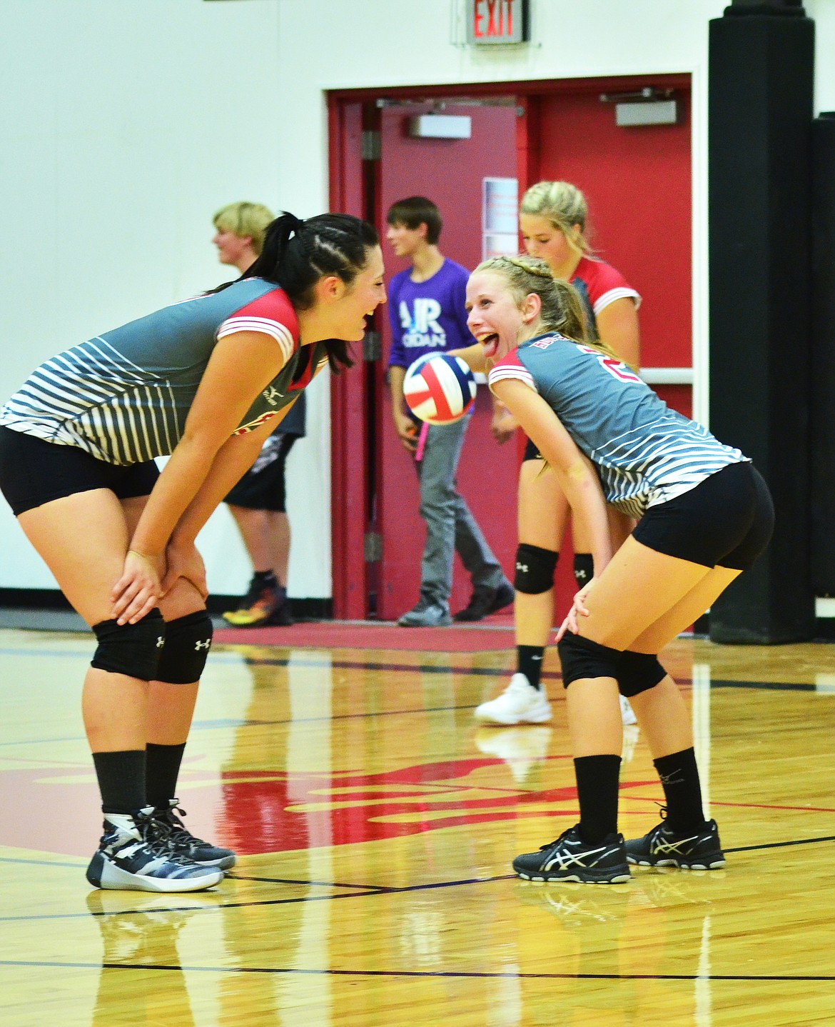 The girls get set and pumped for some offensive action on the volley ball court. (Erin Jusseaume/ Clark Fork Valley Press)
