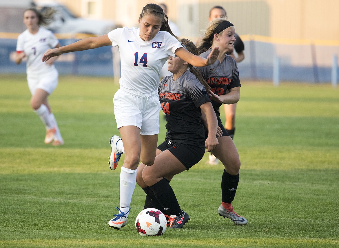 Lakia Hill fights for possession against Frenchtown.