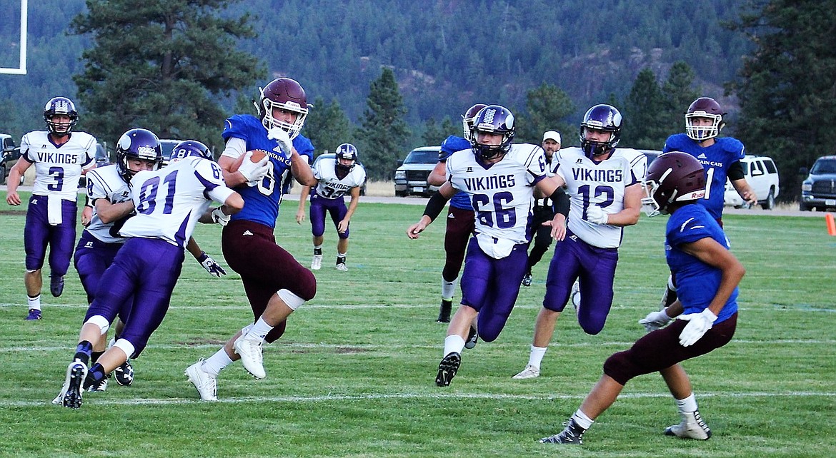 Clark Fork Senior Connor Voll dodges Charlo Viking players during their game on Friday, Sept. 1, in Alberton. (Kathleen Woodford/Mineral Independent)