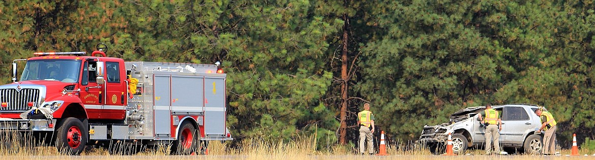 Montana Highway Patrol direct traffic and follow-up on a single-vehicle accident near Tarkio on Aug. 29 where Bonita Fricke, 68, from Superior died from her injuries. (Kathleen Woodford/Mineral Independent).