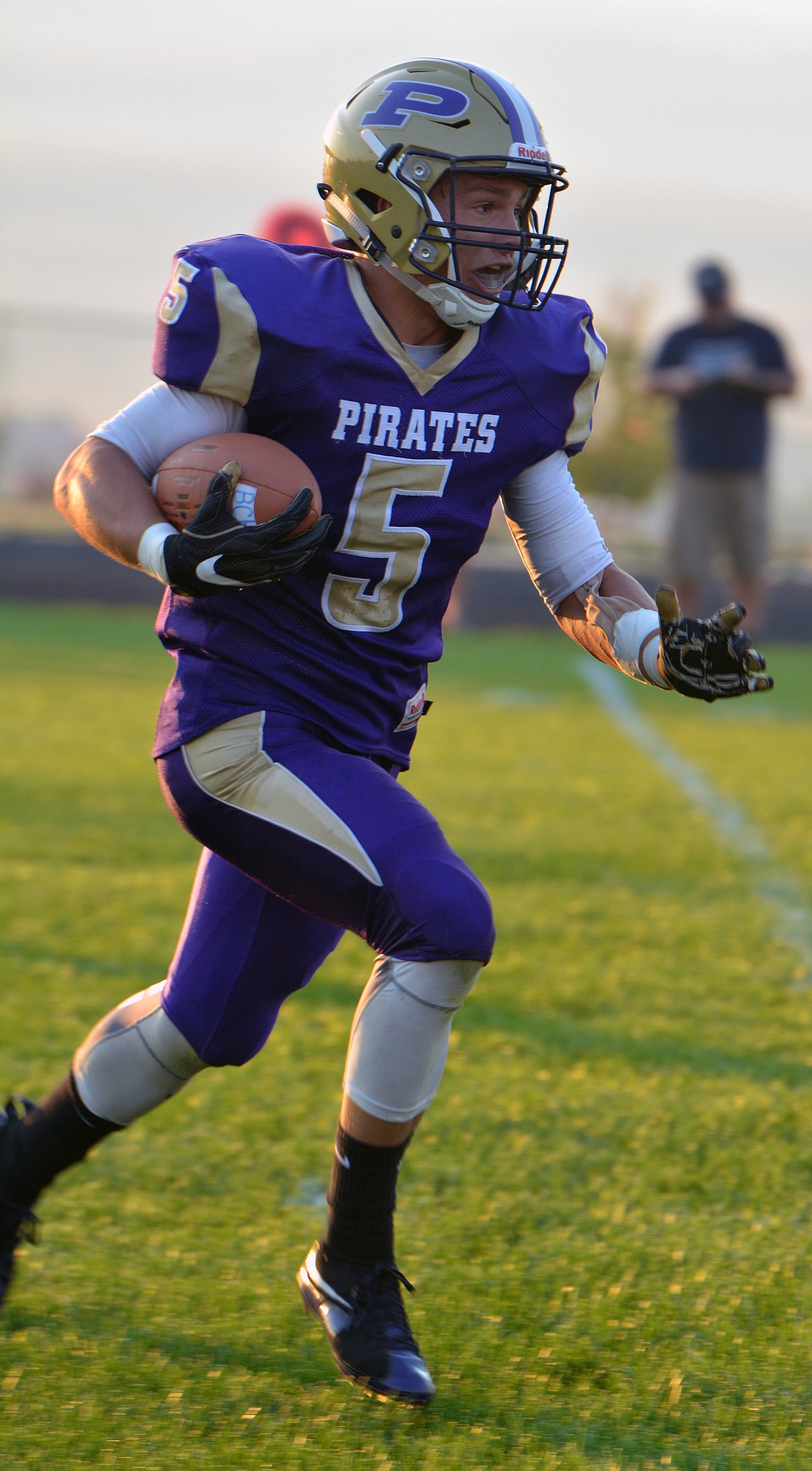 POLSON PIRATE Koby Garcia attempts to returns a punt early in the first half against Dillon in Friday night&#146;s season-opener at Polson High School. (Jason Blasco/Lake County Leader)