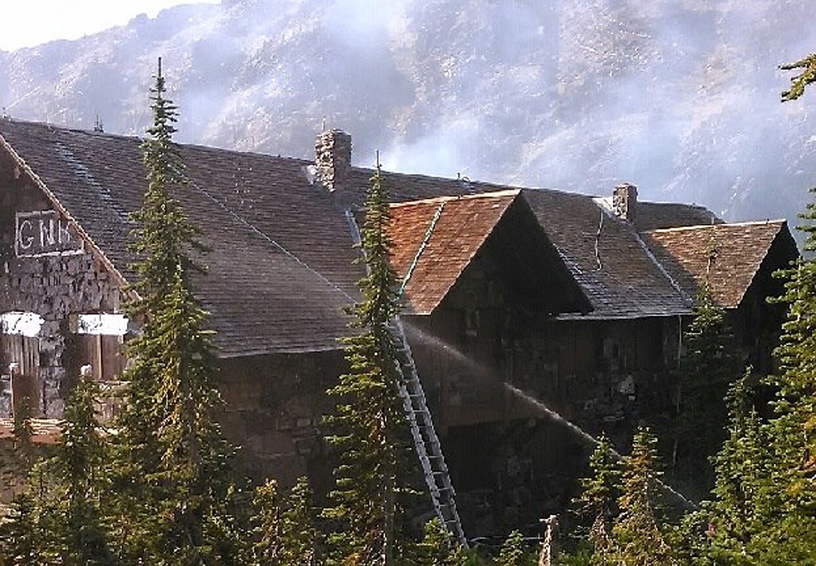 In the Aug. 27 photo, firefighters work to protect the Sperry Chalet in Glacier National Park. On Aug. 31, the chalet was lost to the Sprague Fire. (Photo courtesy of Glacier National Park via Facebook)