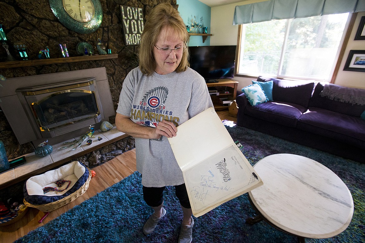 LOREN BENOIT/PressButch Patrick signed a Munsters book for Coeur d'Alene's Sue Jones that she rescued from a throw-away pile from an area library.