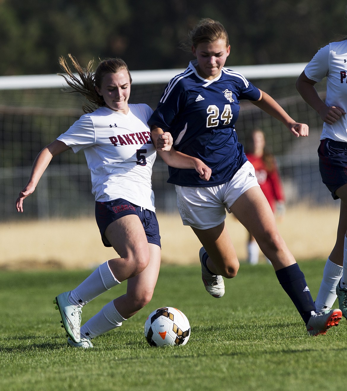 LOREN BENOIT/Press
Coeur d&#146;Alene Charter&#146;s Emily Nicklay (5) and Timberlake&#146;s Georgie Simpson fight for the ball at midfield during Tuesday&#146;s match at Community United Methodist Church.