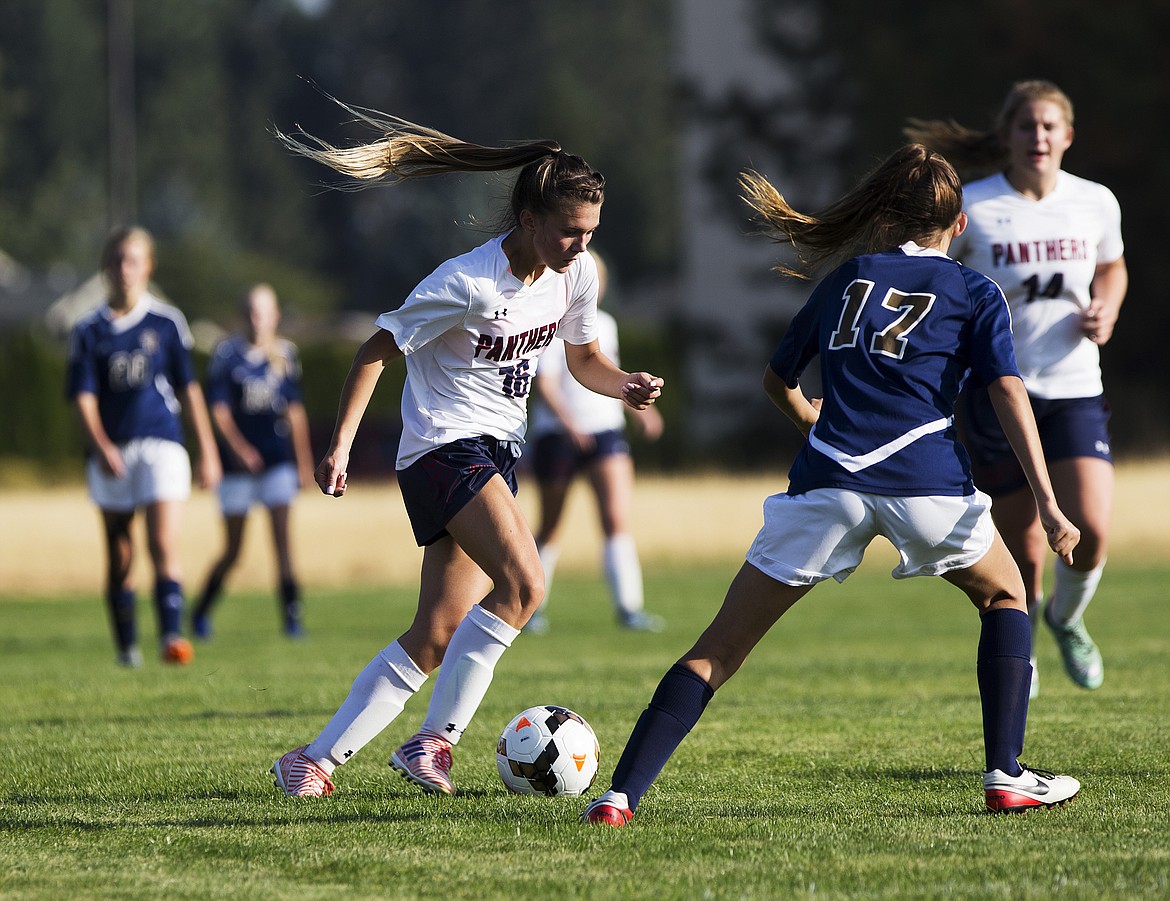 LOREN BENOIT/Press
Coeur d&#146;Alene Charter&#146;s Eliason Cherrstrom dribbles the ball to midfield in a game against Timberlake High School on Tuesday.