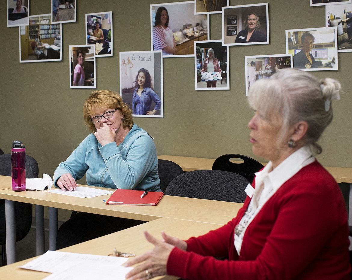 LOREN BENOIT/PressLeslie Gorsuch listens as Union Gospel Mission Vocational Education Coordinator Marsha Reese speaks to a group of women about proper work attire.