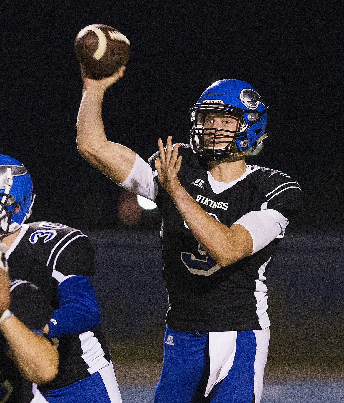 LOREN BENOIT/PressCoeur d'Alene quarterback Cole Yankoff passes the ball to one of his wide receivers during a game against Moses Lake High School on Friday.