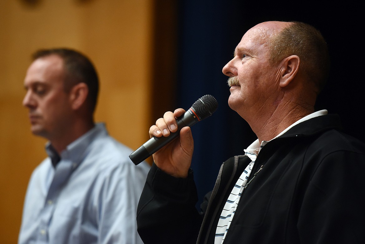 Flathead County Undersheriff Dave Lieb assures a crowd of concerned family members that based on what they have learned in their investigation the threat is most likely a cyber threat rather than a physical threat to students. Lieb and Peters both have family members who are in the affect school system and told the crowd that their own children and grandchildren will be returning to school when they reopen. (Brenda Ahearn/Daily Inter Lake)