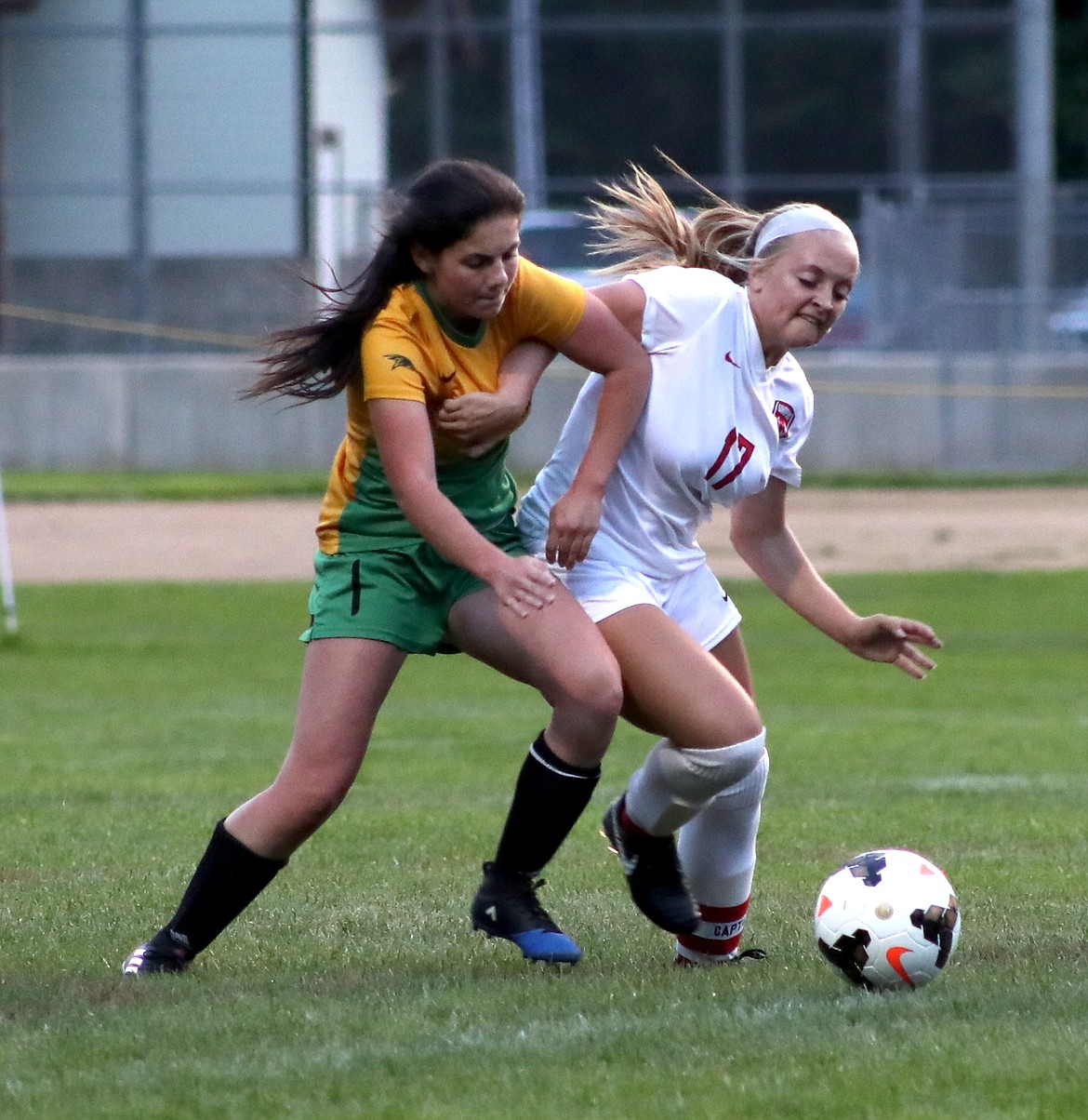 (Photo by ERIC PLUMMER)
Lakeland&#146;s Makayla Higbee, left, battles with Sandpoint&#146;s Riley Walkington on Monday in a 4A Inland Empire League game that was called official at half after lightning began striking in the area.