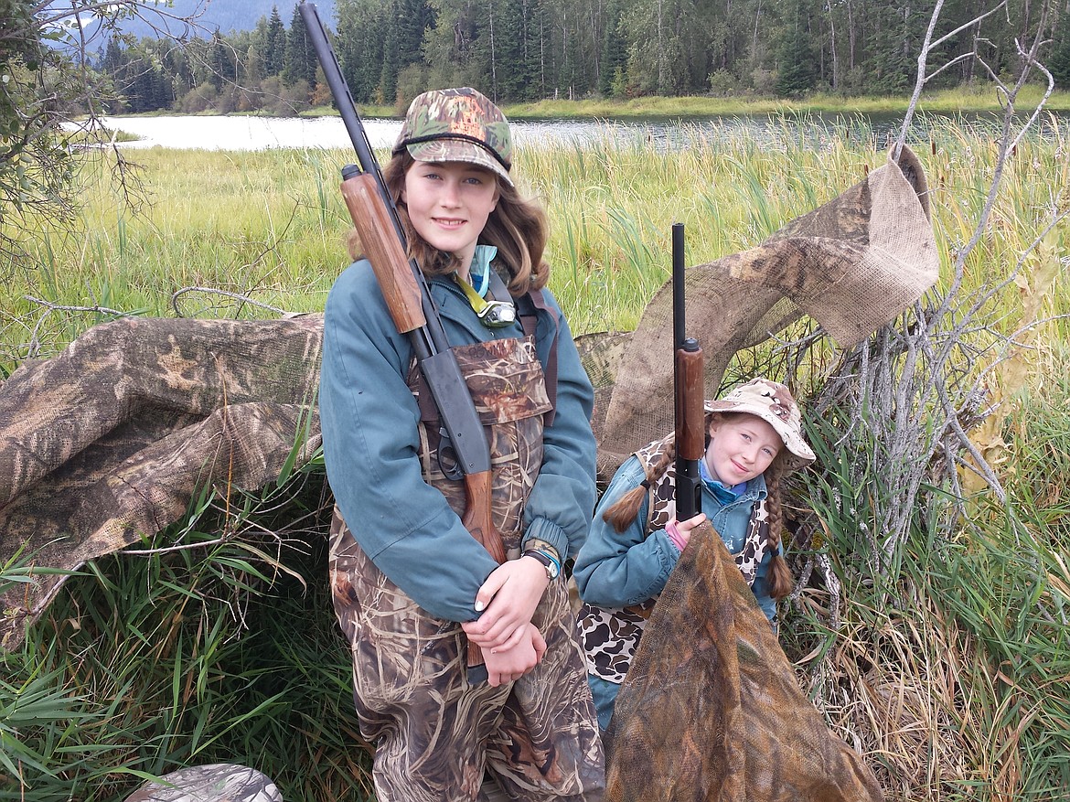 (Photo courtesy IDAHO DEPARTMENT FISH &amp; GAME)
A pair of youngsters get their picture taken at a past mentored waterfowl hunting event.