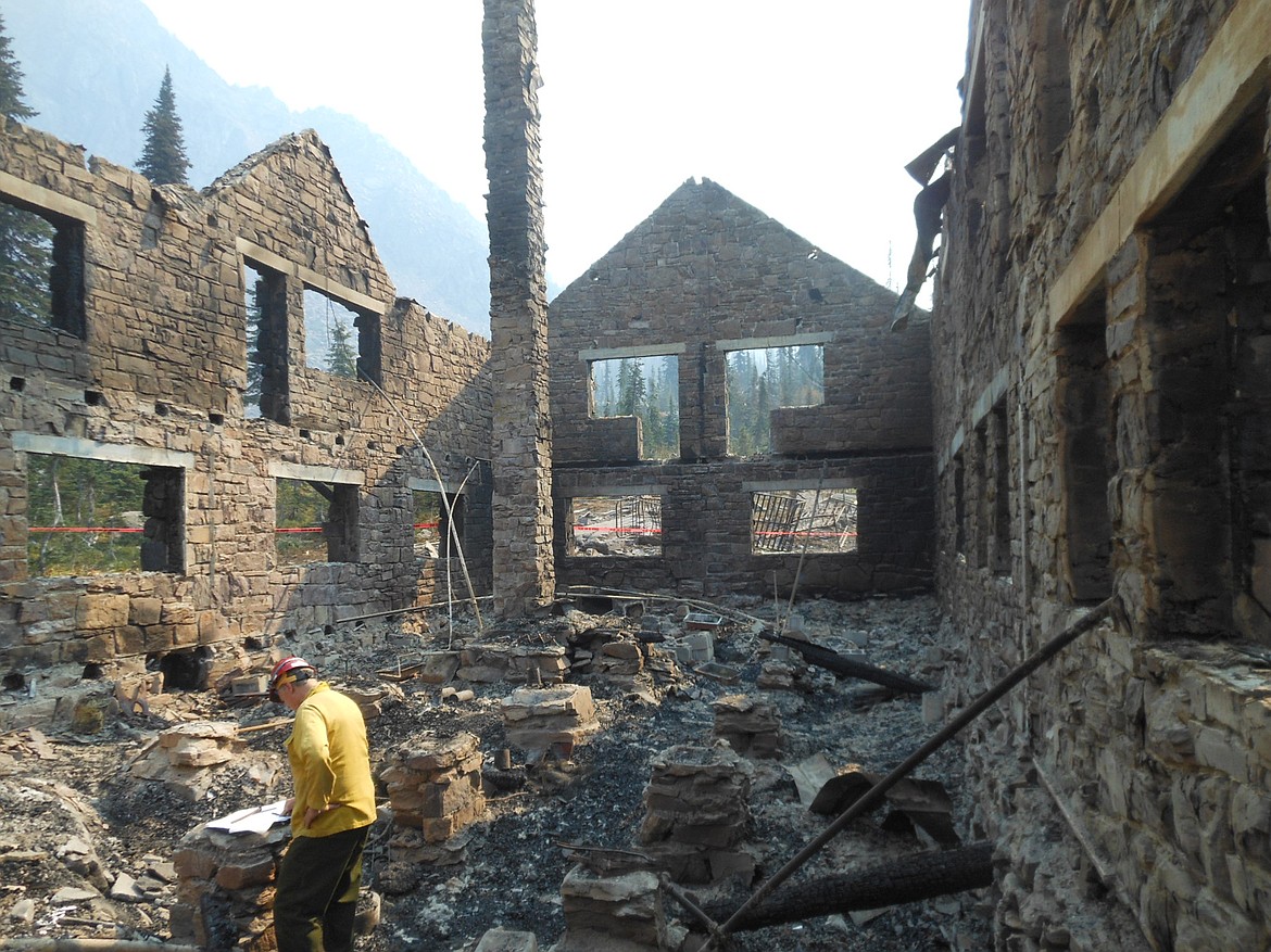 Engineers inspect the Sperry Chalet at Glacier Park. The chalet was gutted by the Sprague Fire on Aug. 31.