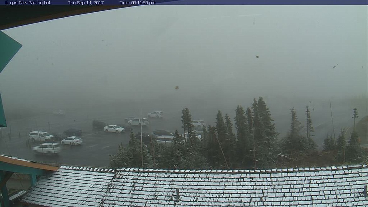 The Logan Pass Visitor Center webcam shows a dusting of snow in Glacier Park on Friday morning.