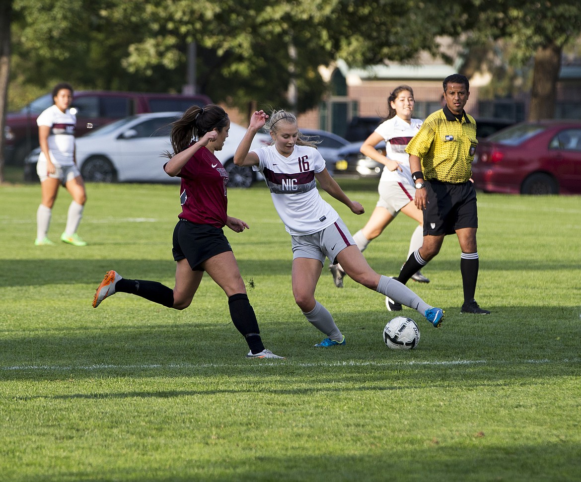 LOREN BENOIT/PressNorth Idaho College midfielder Ellory Ferris dribbles the ball away from Yakima Valley's Courtney Abrams during Wednesday's match at NIC. NIC won 1-0.