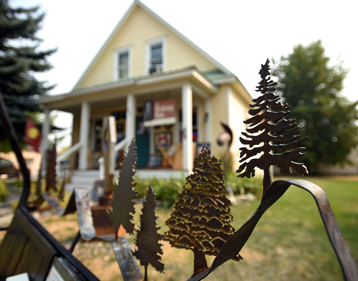 A ski lift chair created by artists Michelle Saurey, Mark Baumbach and Terence Gill sits outside the Walking Man Frame Shop and Gallery in Whitefish.