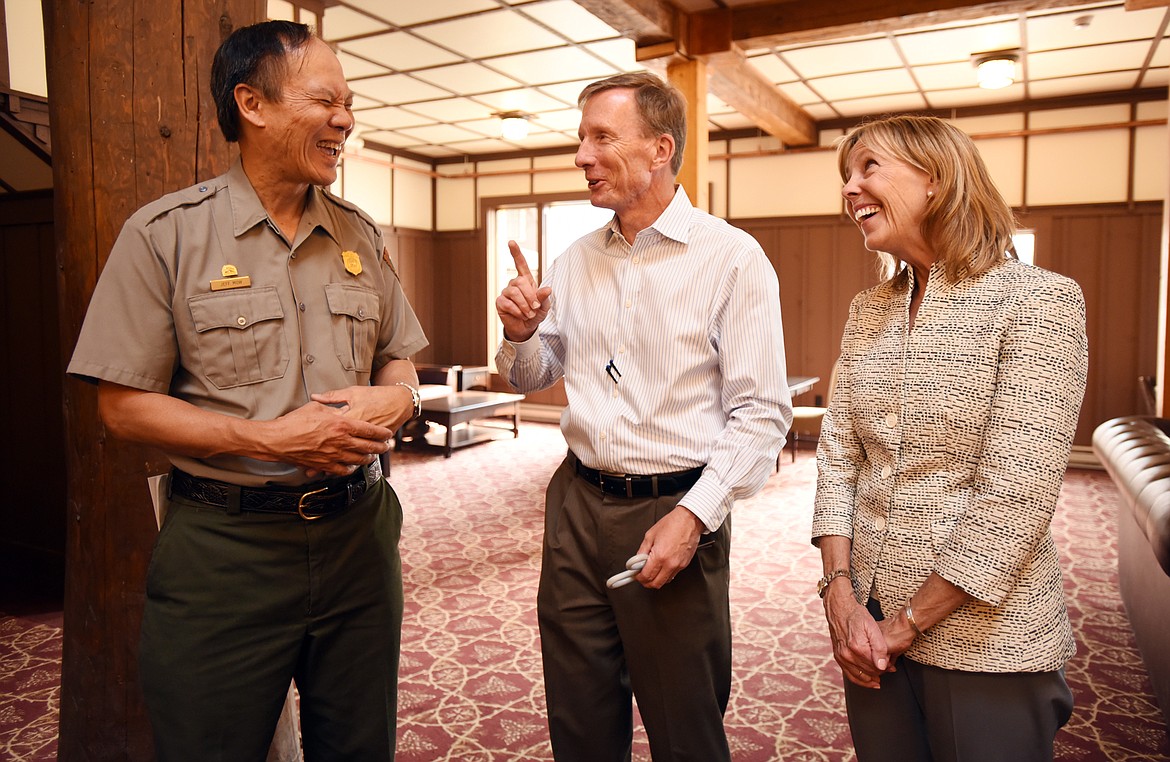 From left, Jeff Mow, superintendent of Glacier National Park, Doug Mitchell, executive director of the Glacier National Park Conservancy, and Barbara Pahl, vice president for Western Field Services for the National Trust at National Trust for Historic Preservation share a laugh following their remarks at a media day revealing renovations at the Many Glacier Hotel on Tuesday.