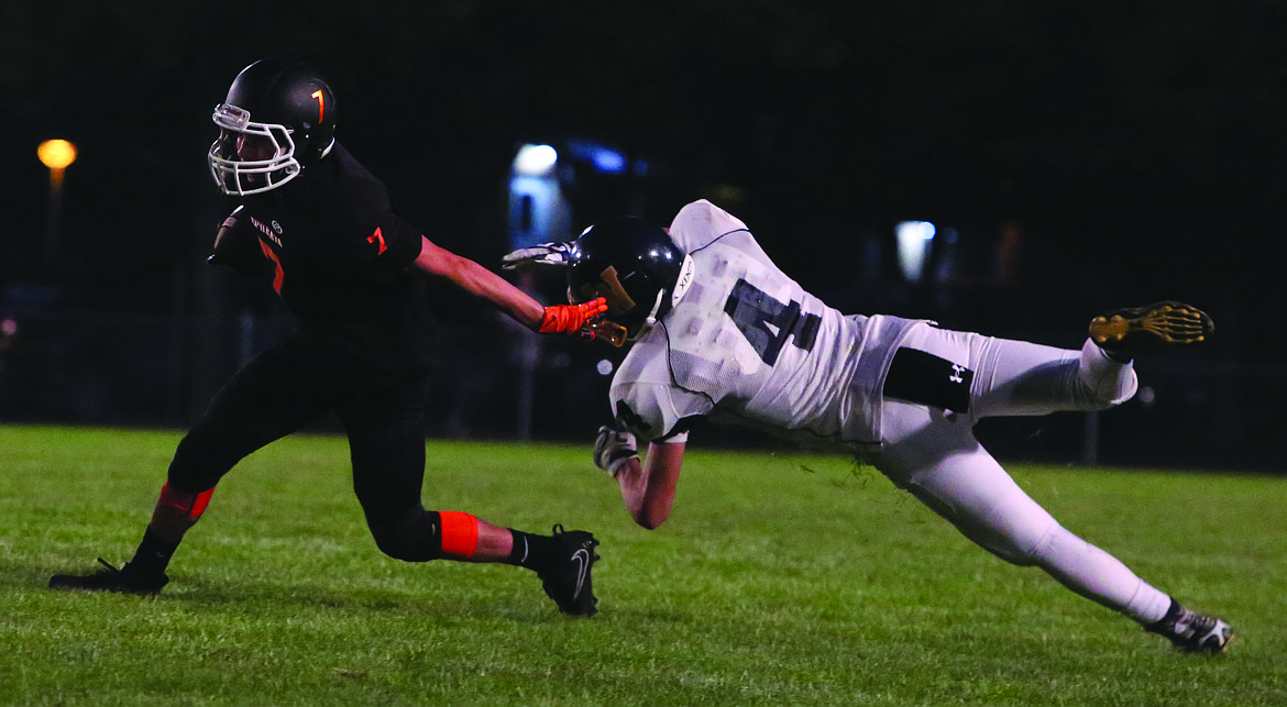 Connor Vanderweyst/Columbia Basin Herald
Ephrata receiver Chase Lus eludes Wapato defender Damien Travis.