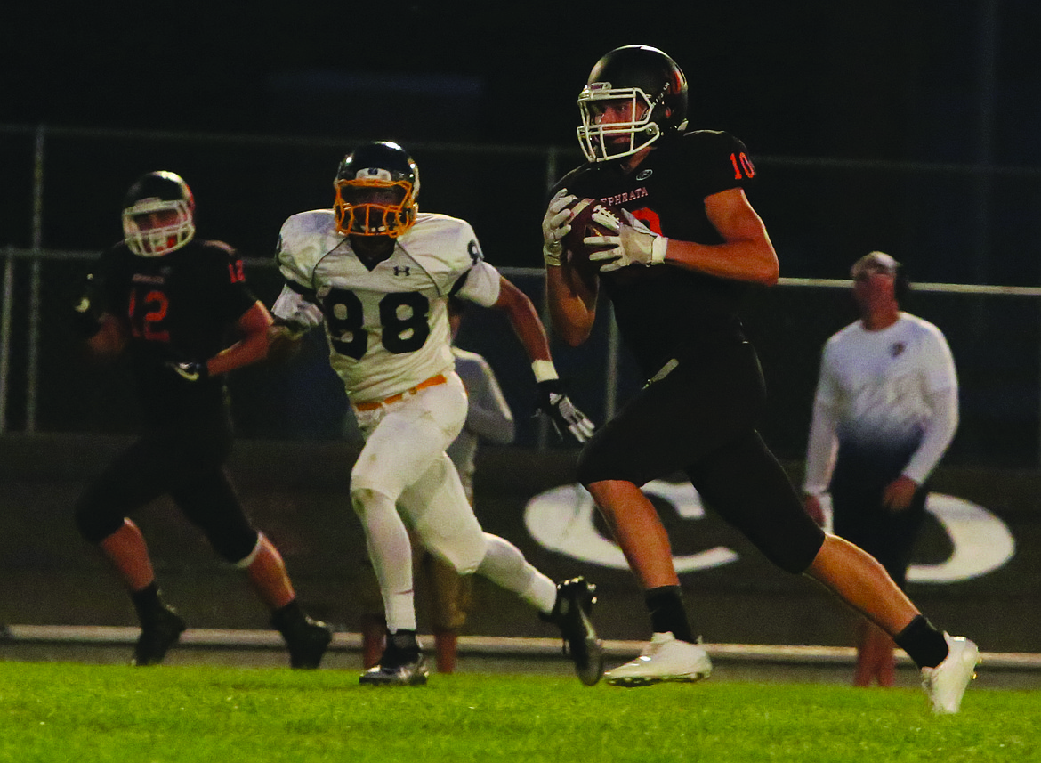 Connor Vanderweyst/Columbia Basin Herald
Ephrata wide receiver Chris Walker sprints to the end zone against Wapato.