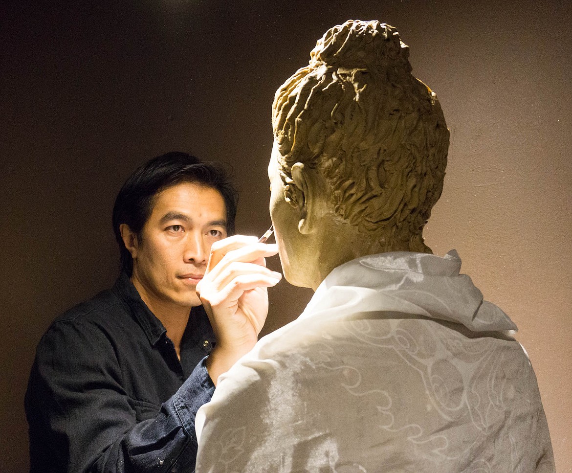 Sunti Pichetchaiyakul works on a sculpture of the Buddha at his studio in Whitefish. (Daniel McKay/Whitefish Pilot)