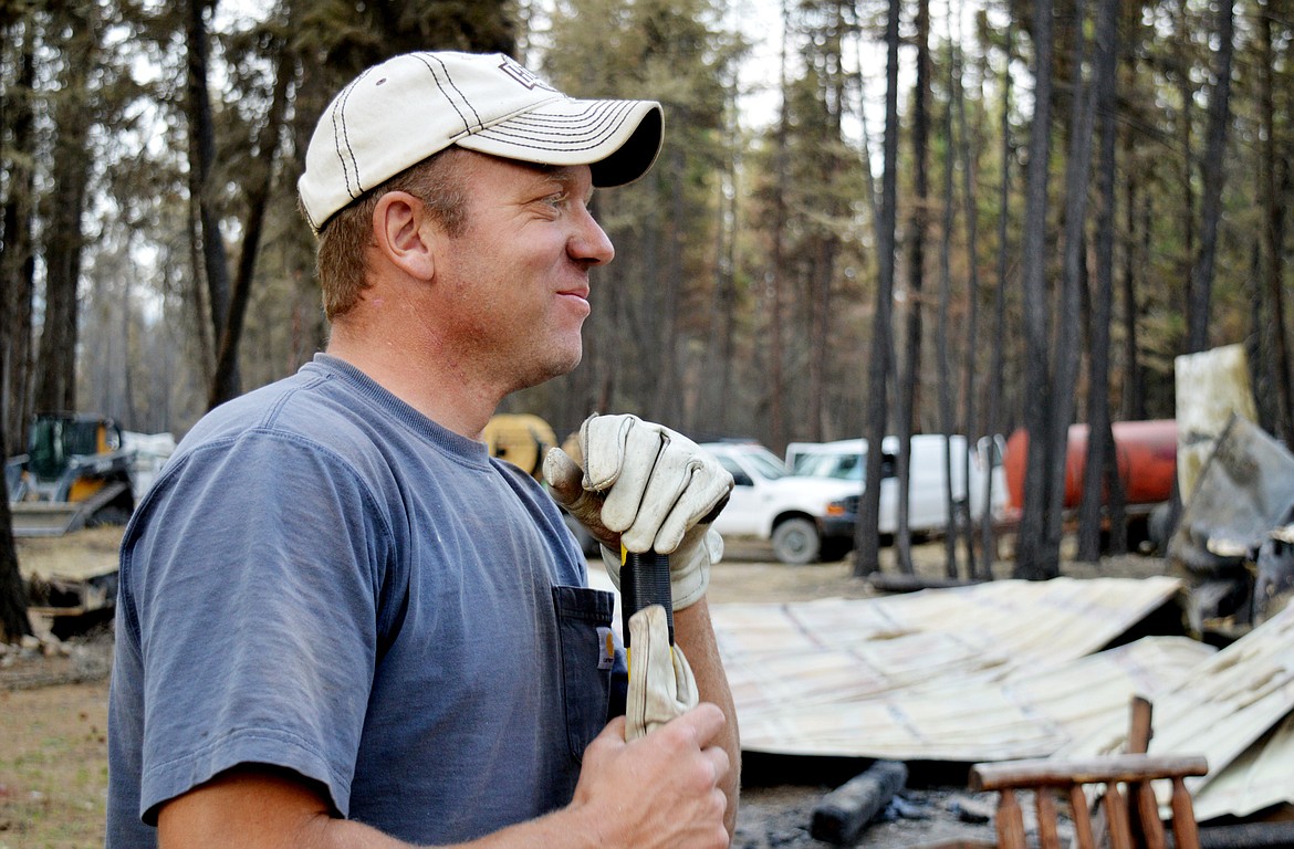 Ian Caswell stands among the remains of his home in West Kootenai on Wednesday after it was consumed in the Caribou Fire on Sept. 2. The fire burned 13 acres owned by Caswell and claimed a total of 40 structures in the West Kootenai area over a two-day period. (Mary Cloud Taylor/Daily Inter Lake)