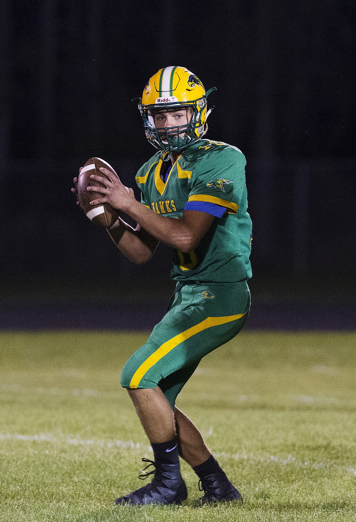 LOREN BENOIT/Press
Lakeland quarterback Brandon Furey looks for a wide receiver downfield during a game against Colville.