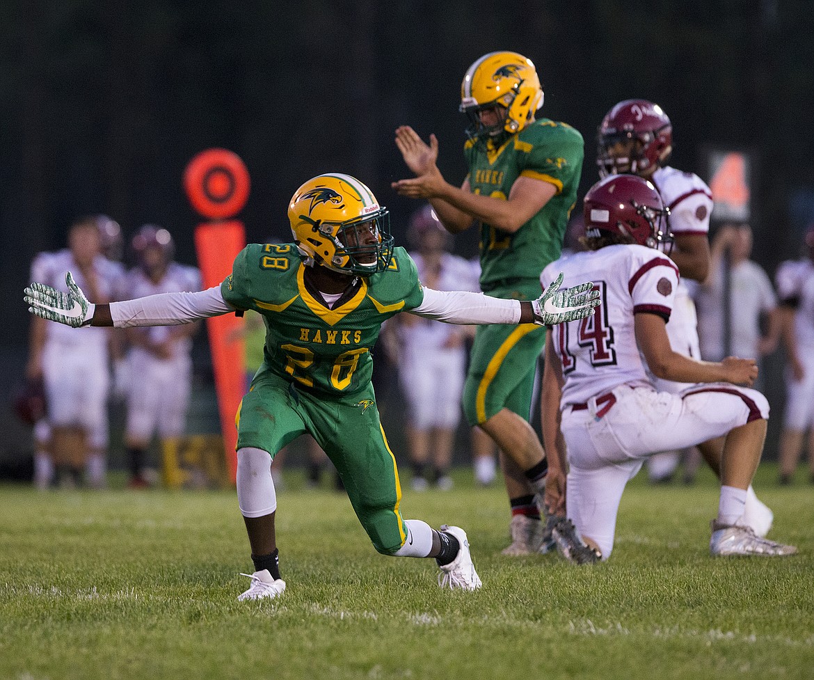 LOREN BENOIT/Press
Lakeland High wide receiver Trey McArthur looks for a pass interference call during a game against Colville on Sept. 1.