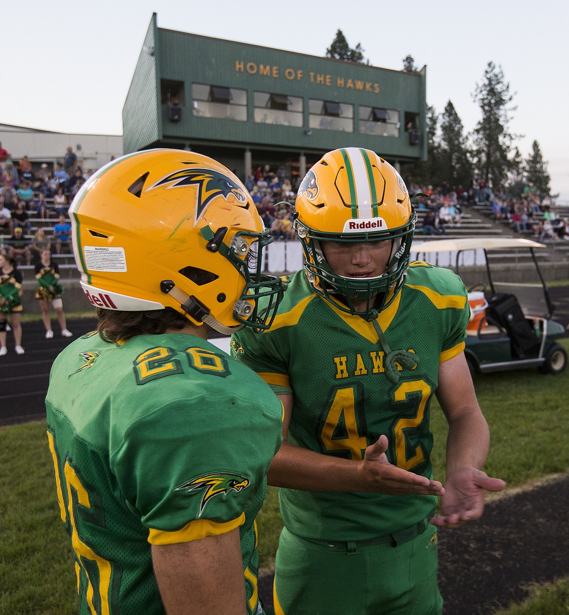 LOREN BENOIT/Press
Cage Hendry, left, and Jake Pope discuss a play on the sidelines during a game against Colville High School.