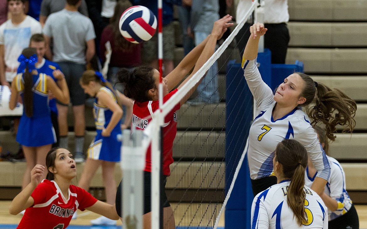 Libby&#146;s Emily Mossburg, No. 7, goes for a kill against Browning Saturday. (John Blodgett/The Western News)