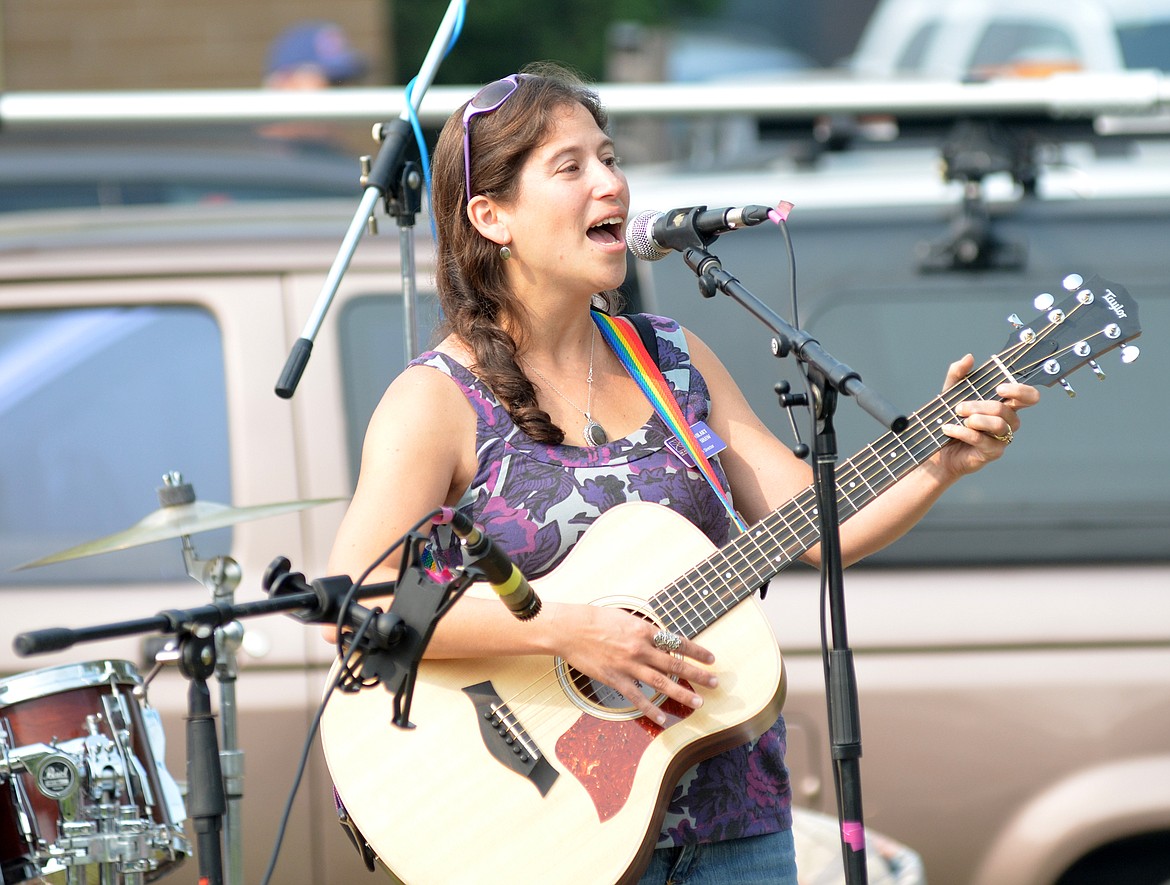 Hilary Shaw, executive director of the Abbie Shelter, sings Saturday during the Whitefish Community Foundation&#146;s Nonprofit Fair at Depot Park. As part of this year&#146;s Great Fish Community Challenge, nonprofits are competing in a Jingle Competition. Finalist performed their jingles Saturday for the chance to be awarded a $1,000 grant at the Great Fish Awards event Oct. 12. (Heidi Desch/Whitefish Pilot)