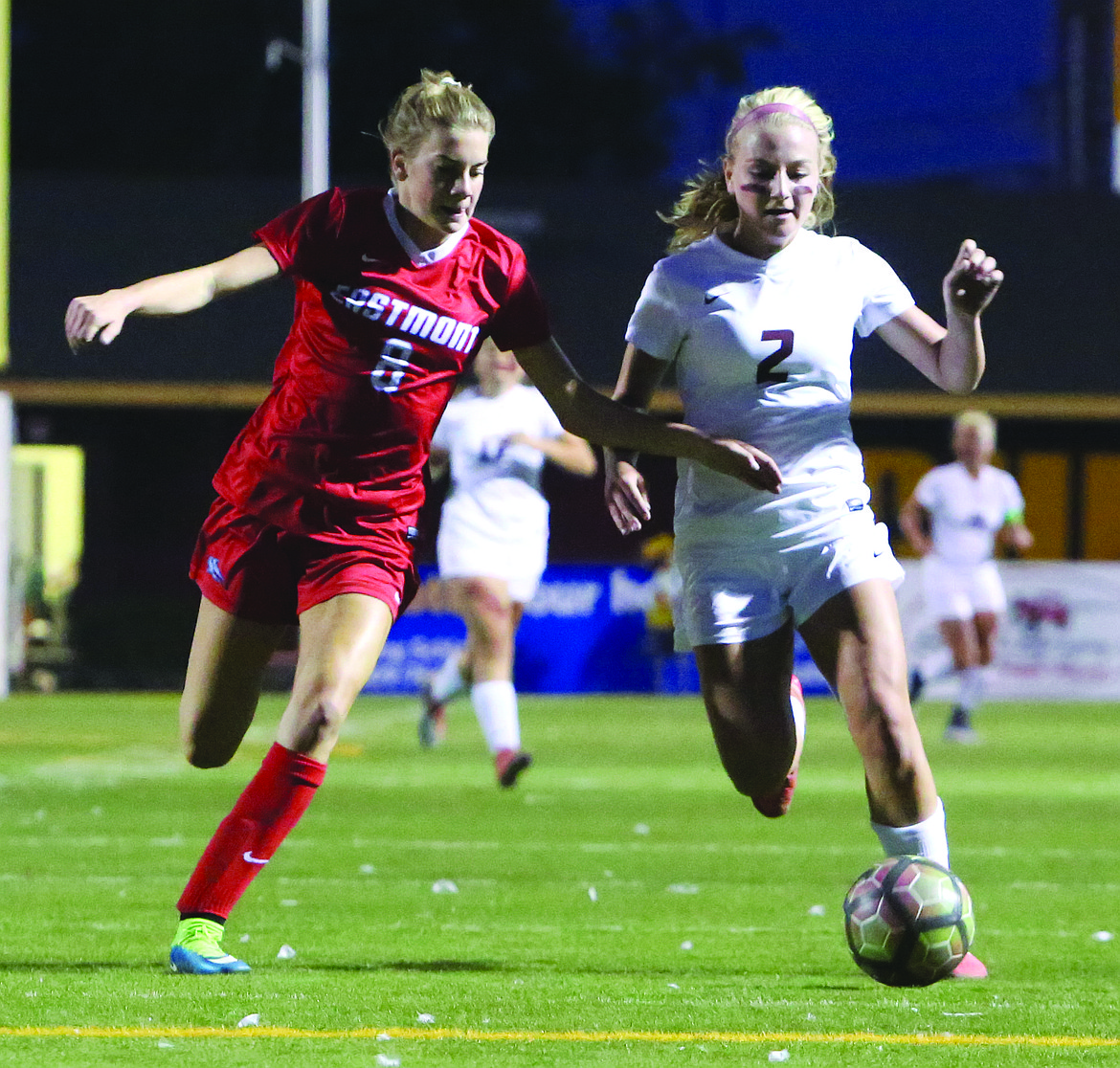 Connor Vanderweyst/Columbia Basin Herald
Moses Lake forward Madi Krogh (2) races to the ball next to Eastmont defender Alyssa Konarek.