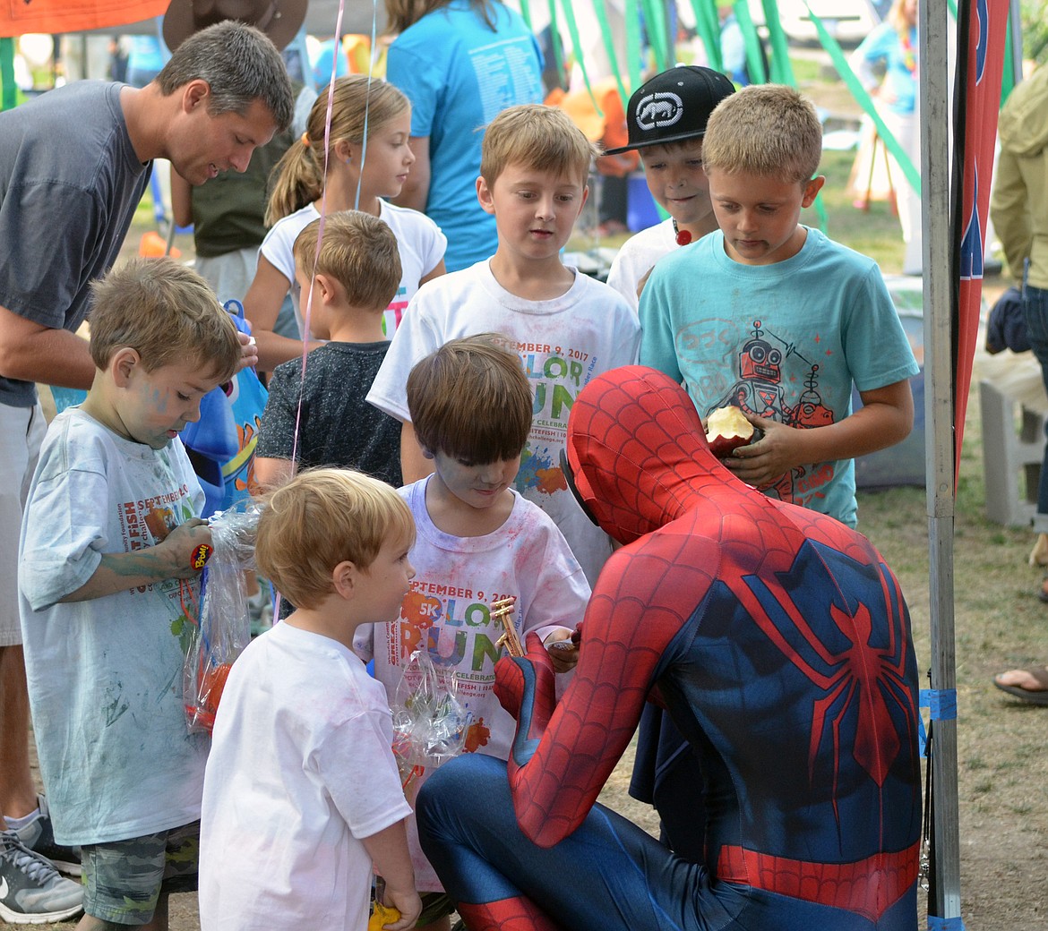 Spider-Man was popular handing out pencils at the CASA both Saturday during the Whitefish Community Foundation&#146;s Nonprofit Fair at Depot Park. (Heidi Desch/Whitefish Pilot)