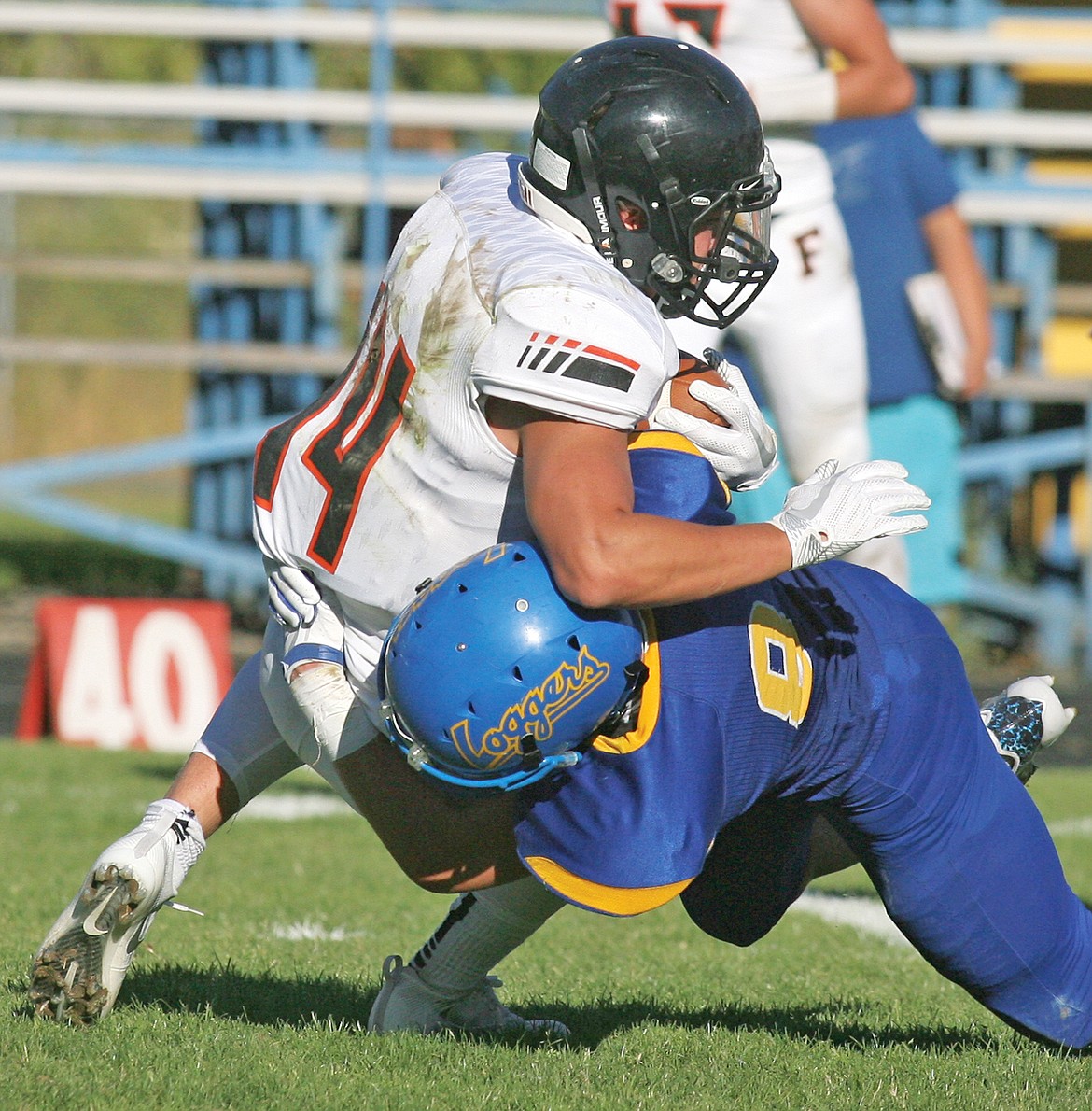 Freshman Dawson Young tackles Frenchtown&#146;s Tel Arthur in fourth quarter Monday. Loggers bow to Broncs 41-14. (Paul Sievers/The Western News)