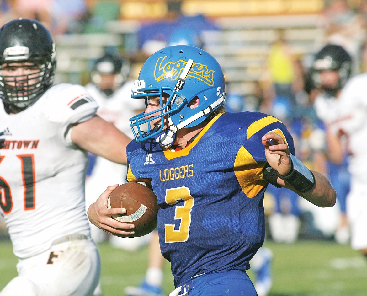 Senior quarterback Brian Peck on a &#147;keeper&#148; to the Libby 20-yard line in the third quarter vs. Frenchtown Sept. 12. (Paul Sievers/The Western News)