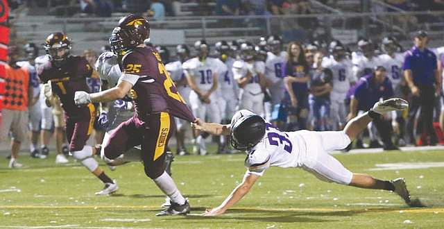 Connor Vanderweyst photo - The Chiefs Brandon Swett shakes off a Falcon tackler in route to a 19-yard TD run.