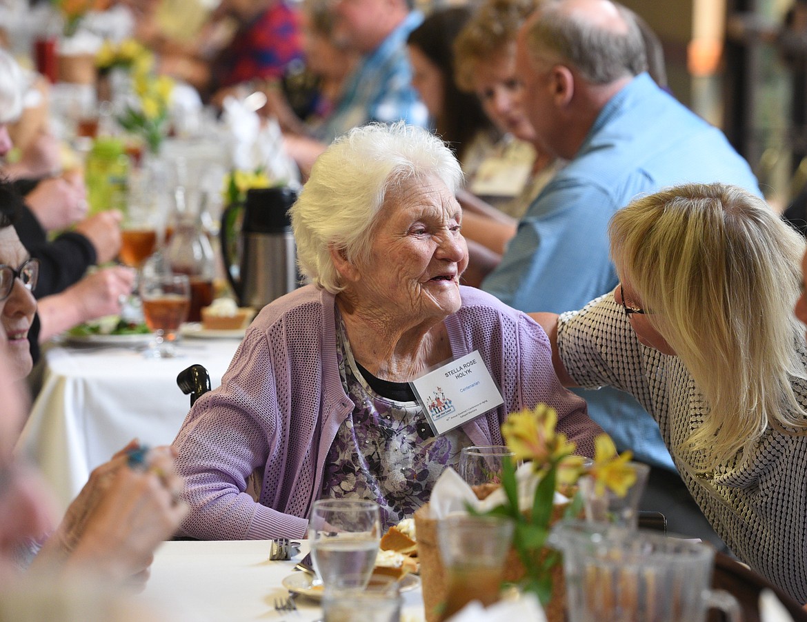 Stella Rose Holyk, 100, speaks with Julie White during the Montana Centenarians luncheon. (Aaric Bryan/Daily Inter Lake)