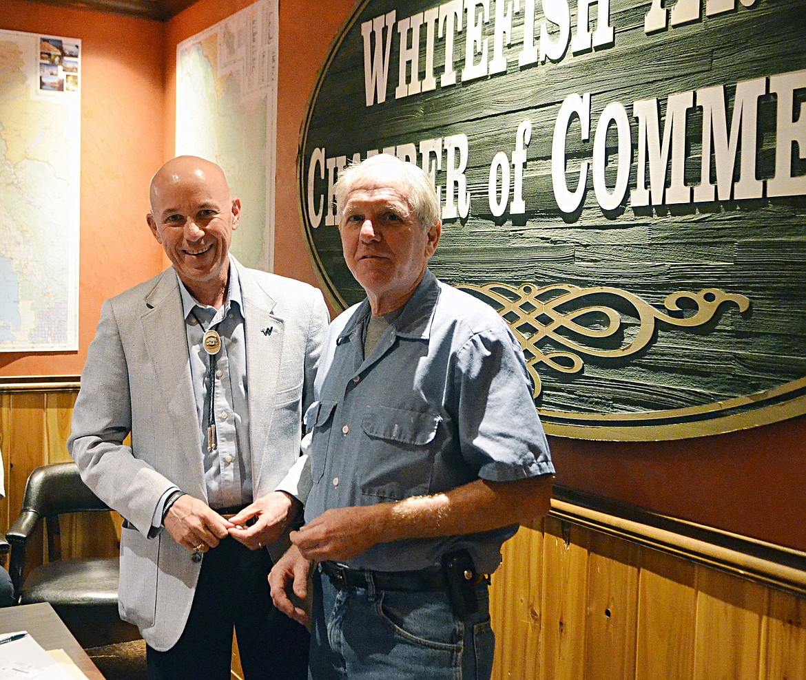 Webb Brown, president of the Montana Chamber of Commerce, presents Democratic legislator Rep. Dave Fern with the state chamber&#146;s &#147;Champion of Business&#148; award Thursday morning at the Whitefish Chamber of Commerce office. (Heidi Desch/Whitefish Pilot)