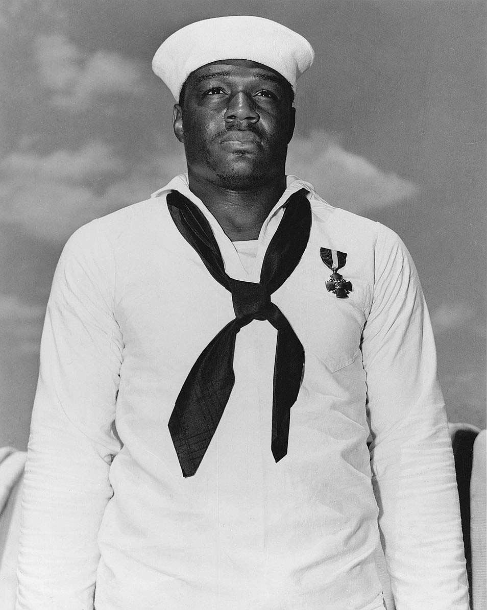 U.S. NAVY PHOTO
Doris &#147;Dorie&#148; Miller wearing his Navy Cross, awarded for remaining in dangerous location risking his life to help try to save badly wounded Captain Mervyn Bennion of Preston, Idaho.