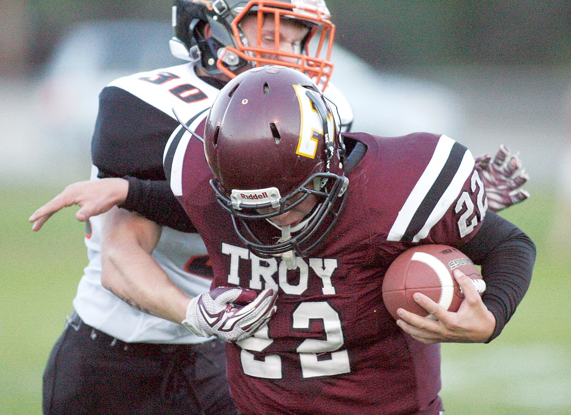 Cy Winslow on the carry to the Plains 19-yard line in second quarter Monday, Sept. 11. Trojans fall to Horsemen 46-20. (Paul Sievers/The Western News)