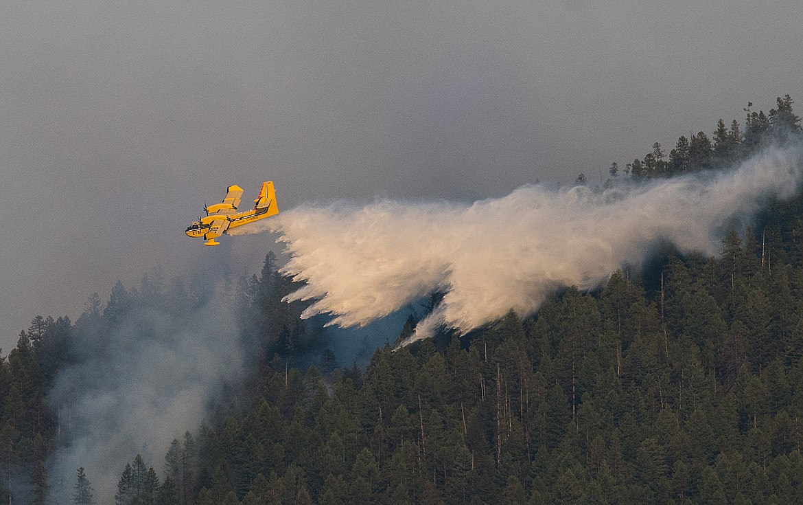 A super scooper drops water on the Sprague Fire Sunday.