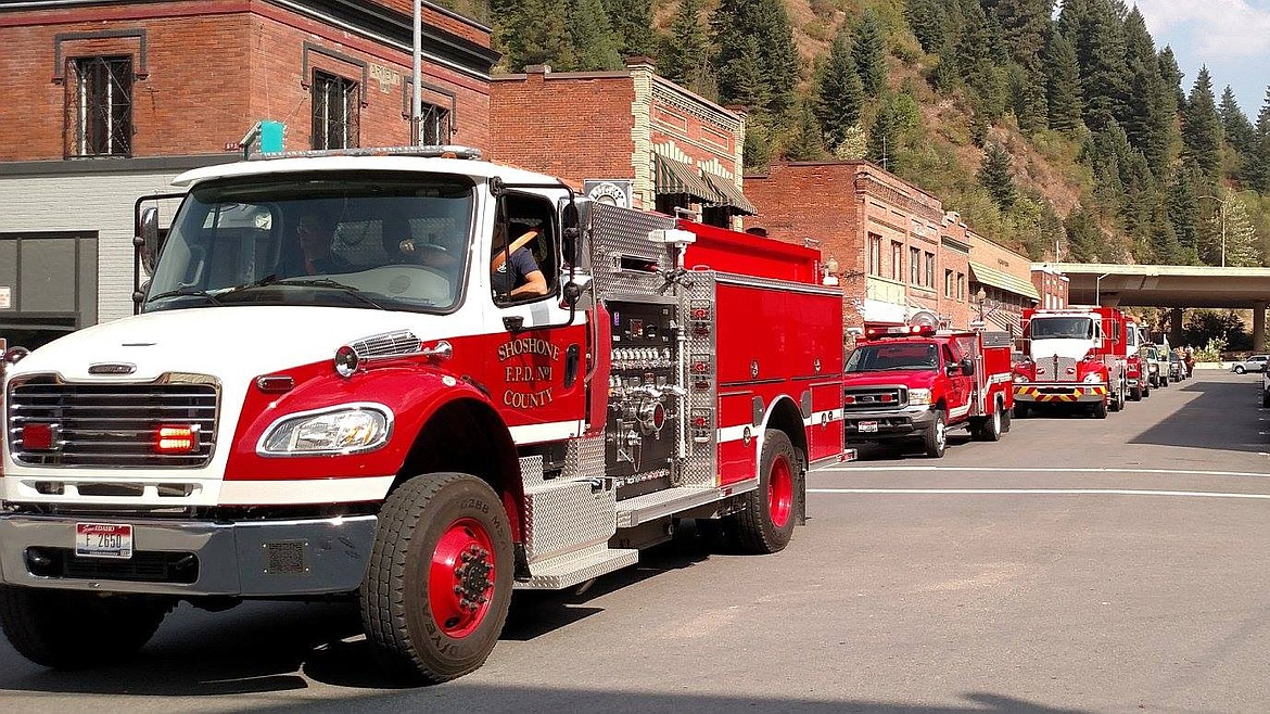 Firefighters get in on the parade fun and cruise down Cedar Street.