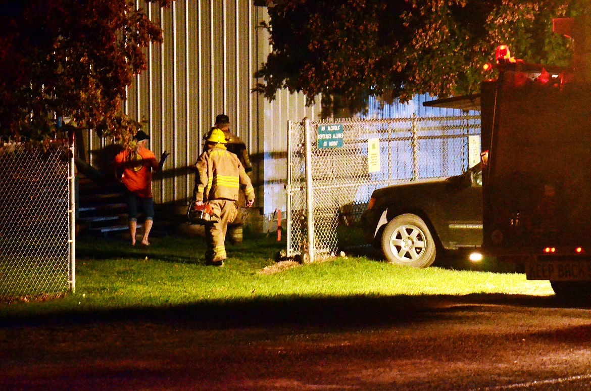 A firefighter arriving on scene at the Fair Grounds. (Erin Jusseaume/ Clark Fork Valley Press)