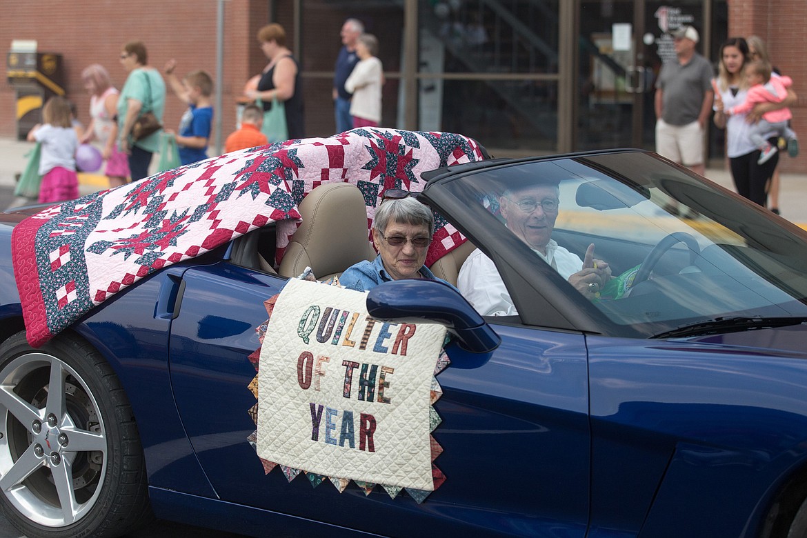Barb Hoetzel, 2017 Quilter of the Year, is driven by George Jamison in the 2017 Nordicfest Heritage Festival parade Saturday in Libby. (John Blodgett/The Western News)